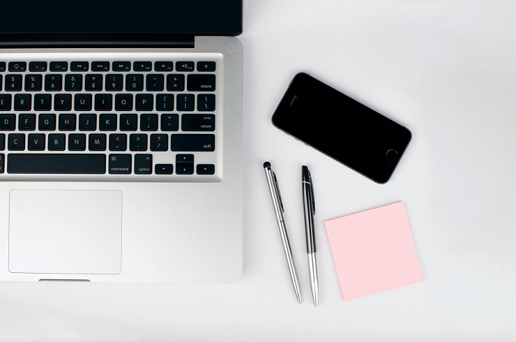 image of laptop with stationery from birdeye perspective